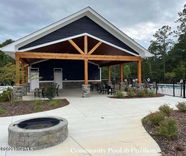 804 Winds Way, Aberdeen, NC 28315 - surrounding community featuring a fire pit, a patio area, and a pool