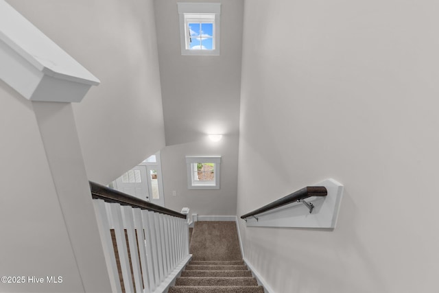804 Winds Way, Aberdeen, NC 28315 - staircase with healthy amount of natural light, carpet floors, and a high ceiling