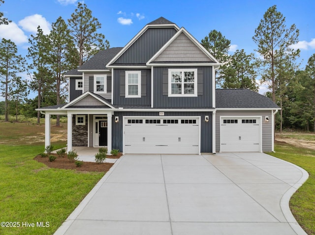 804 Winds Way, Aberdeen, NC 28315 - view of front of property with a porch, a front yard, driveway, and board and batten siding