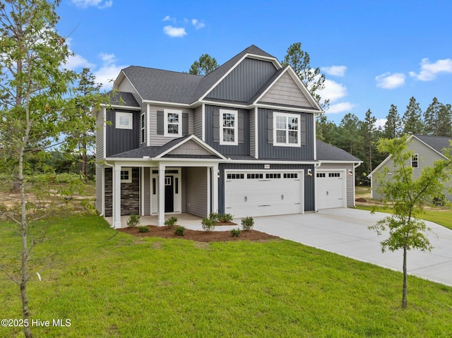 804 Winds Way, Aberdeen, NC 28315 - view of front of property featuring board and batten siding, driveway, a porch, and a front yard