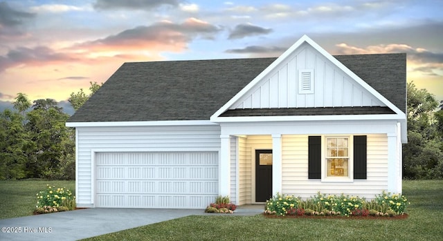 113 Legare St Lot 254, Wilmington, NC 28411 - view of front of home with concrete driveway, board and batten siding, a shingled roof, an attached garage, and a front yard