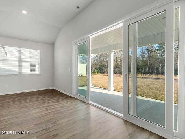 113 Legare St Lot 254, Wilmington, NC 28411 - doorway featuring wood finished floors and vaulted ceiling