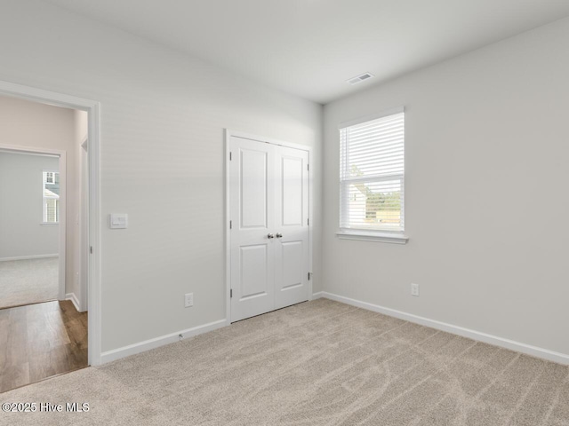 113 Legare St Lot 254, Wilmington, NC 28411 - unfurnished bedroom featuring carpet and a closet