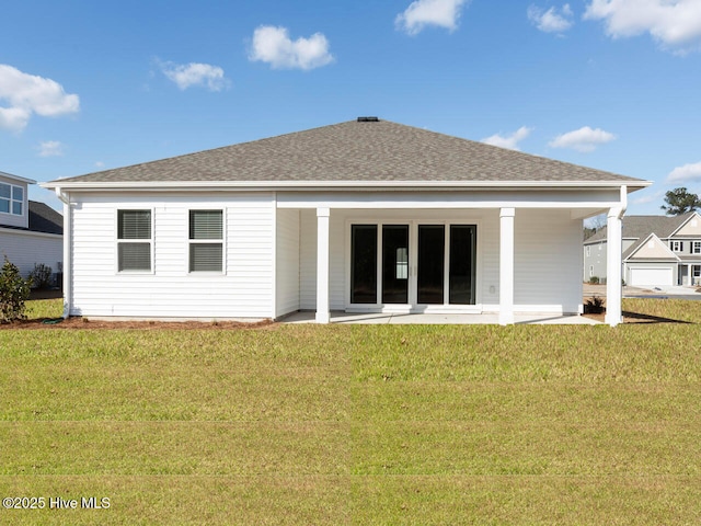 113 Legare St Lot 254, Wilmington, NC 28411 - rear view of property with a yard, a shingled roof, and a patio