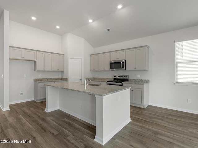 113 Legare St Lot 254, Wilmington, NC 28411 - kitchen featuring stainless steel microwave, electric stove, lofted ceiling, an island with sink, and dark wood-style floors