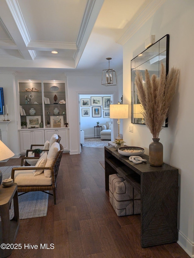 interior space with dark wood-style flooring, crown molding, and a chandelier