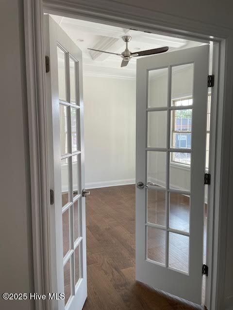 entryway with french doors, baseboards, a ceiling fan, dark wood-type flooring, and ornamental molding