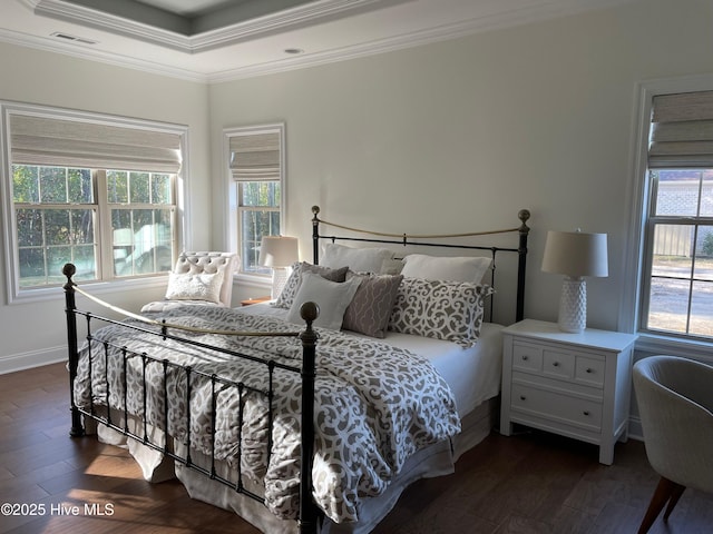 bedroom with baseboards, visible vents, crown molding, and dark wood-style floors