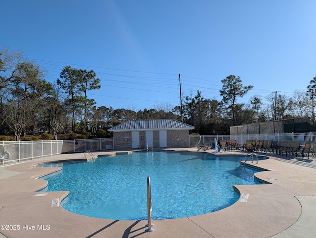 pool featuring a patio area and fence