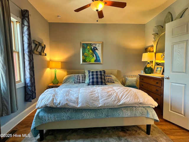 1120 S 3rd St, Wilmington, NC 28401 - bedroom featuring multiple windows, wood finished floors, baseboards, and a ceiling fan