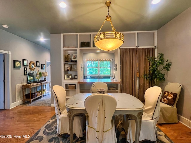 1120 S 3rd St, Wilmington, NC 28401 - dining area with wood finished floors, baseboards, and recessed lighting