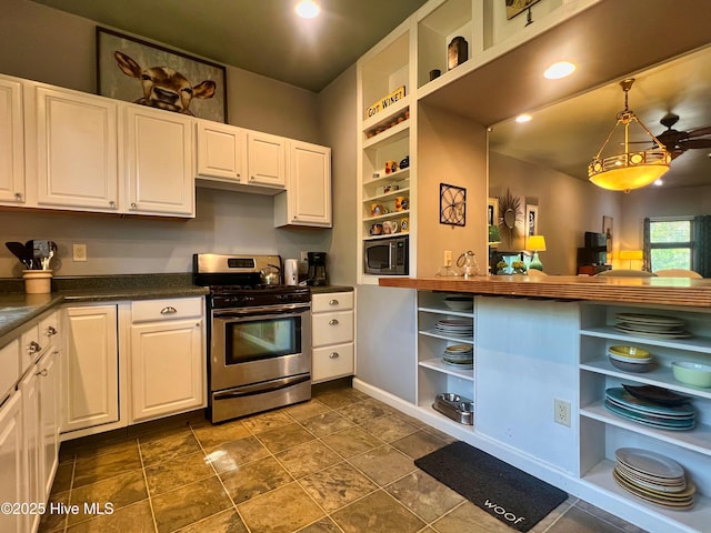 1120 S 3rd St, Wilmington, NC 28401 - kitchen with open shelves, appliances with stainless steel finishes, dark countertops, white cabinetry, and recessed lighting