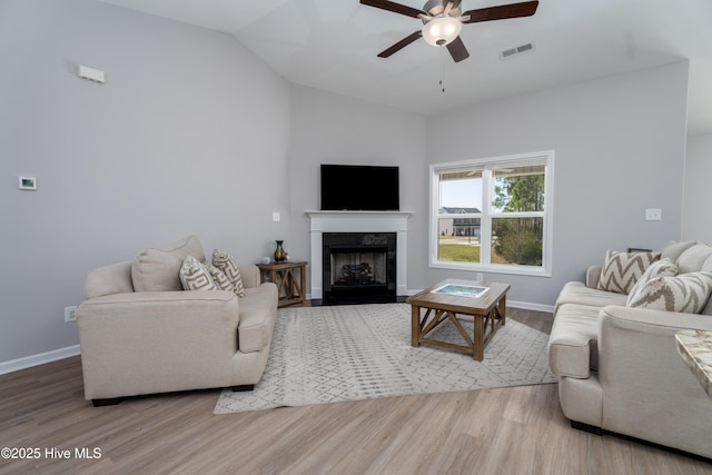 330 Independence Blvd, Newport, NC 28570 - living room featuring a ceiling fan, baseboards, visible vents, a high end fireplace, and wood finished floors