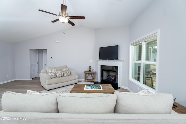 330 Independence Blvd, Newport, NC 28570 - living area with a ceiling fan, lofted ceiling, baseboards, a fireplace with flush hearth, and wood finished floors