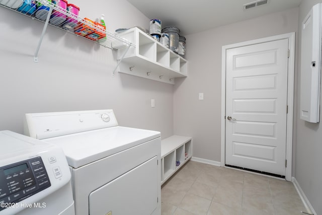 330 Independence Blvd, Newport, NC 28570 - laundry area with washer and dryer, light tile patterned floors, laundry area, visible vents, and baseboards
