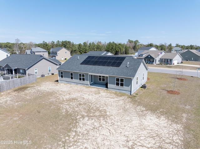 330 Independence Blvd, Newport, NC 28570 - exterior space featuring covered porch, a residential view, fence, a shingled roof, and solar panels
