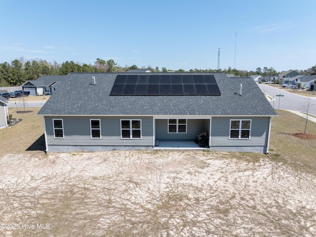 330 Independence Blvd, Newport, NC 28570 - back of property with a residential view, a shingled roof, and roof mounted solar panels