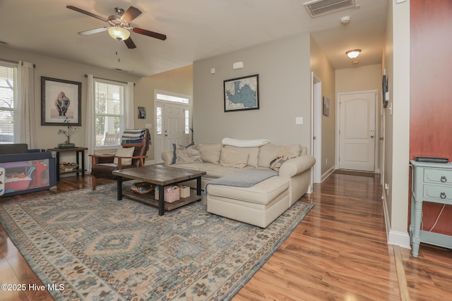 202 Peggys Trce, Sneads Ferry, NC 28460 - living area featuring a wealth of natural light, visible vents, wood finished floors, and a ceiling fan