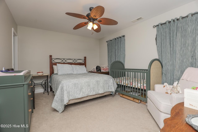 202 Peggys Trce, Sneads Ferry, NC 28460 - bedroom featuring ceiling fan, visible vents, and light carpet