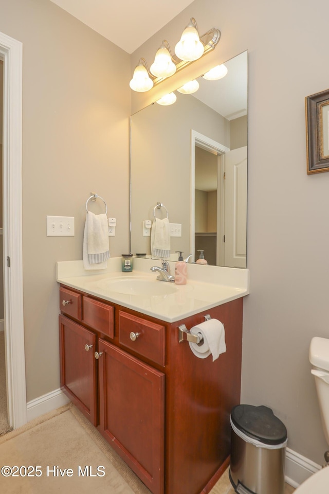 202 Peggys Trce, Sneads Ferry, NC 28460 - half bathroom with baseboards, toilet, and vanity