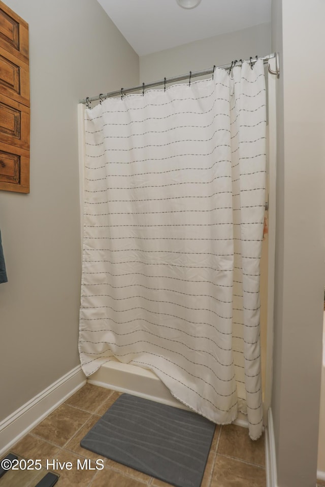 202 Peggys Trce, Sneads Ferry, NC 28460 - bathroom featuring tile patterned floors, curtained shower, and baseboards