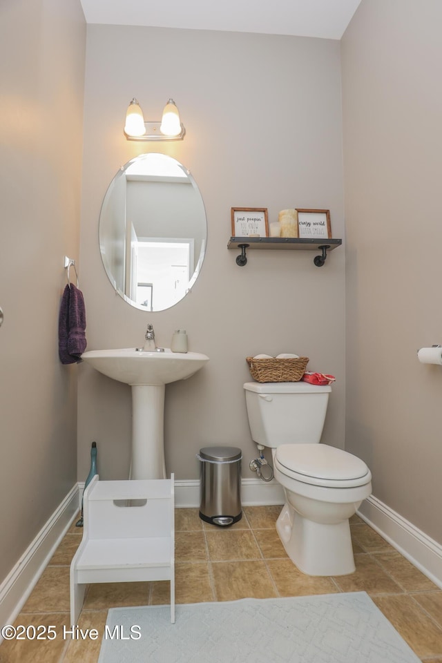 202 Peggys Trce, Sneads Ferry, NC 28460 - half bath with toilet, tile patterned floors, and baseboards