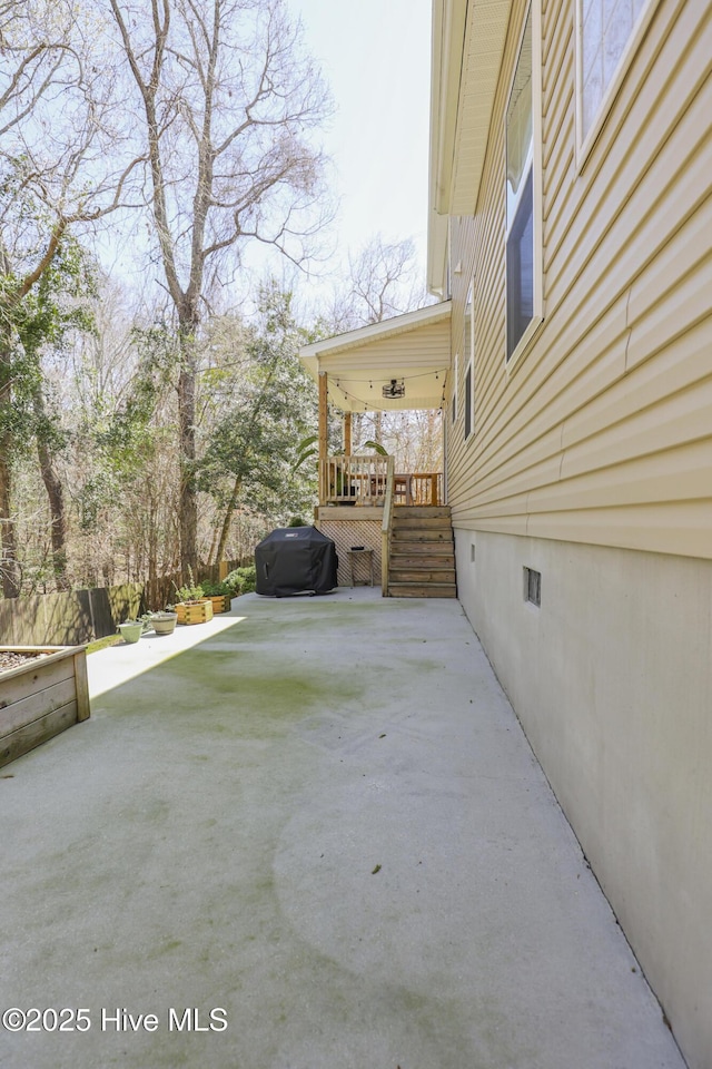 202 Peggys Trce, Sneads Ferry, NC 28460 - view of side of home with stairs, fence, crawl space, a deck, and a patio area