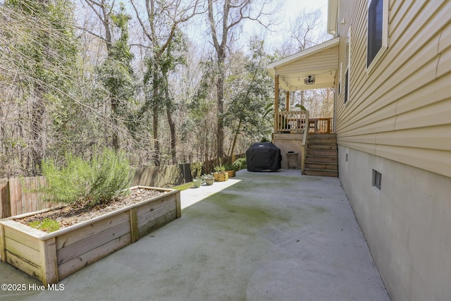 202 Peggys Trce, Sneads Ferry, NC 28460 - view of patio with area for grilling, fence, and a wooden deck