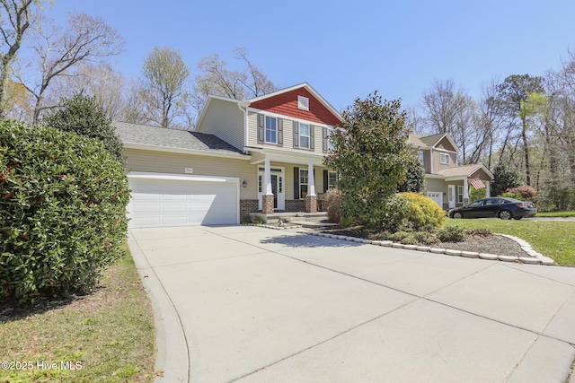 202 Peggys Trce, Sneads Ferry, NC 28460 - view of front facade with an attached garage, concrete driveway, and brick siding