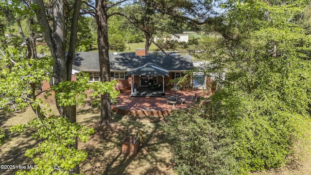 back of house with a patio