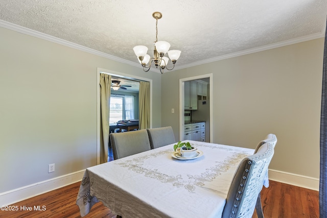dining room with crown molding, a textured ceiling, baseboards, a notable chandelier, and dark wood-style floors