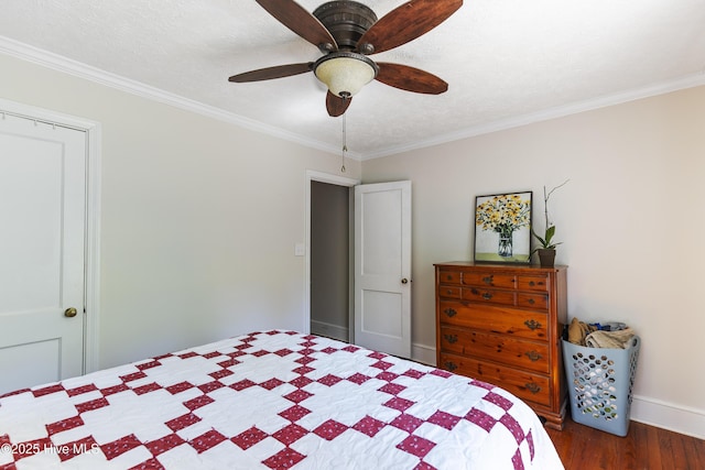 bedroom featuring ceiling fan, dark wood-type flooring, and ornamental molding