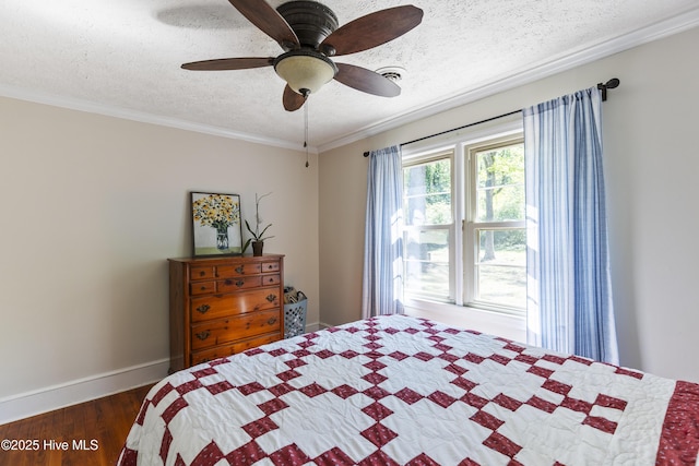 bedroom with a textured ceiling, dark wood-style flooring, baseboards, ceiling fan, and ornamental molding