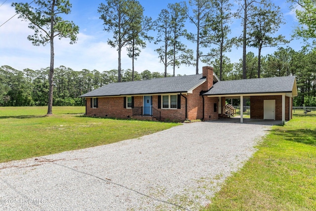 1450 State Camp Rd, Vanceboro, NC 28586 - ranch-style house featuring gravel driveway, a front yard, a chimney, an attached carport, and roof with shingles