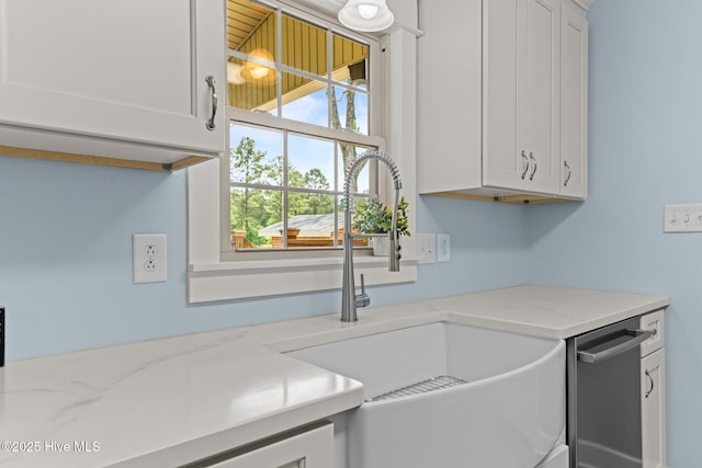 1450 State Camp Rd, Vanceboro, NC 28586 - kitchen with a sink, white cabinets, and light stone countertops