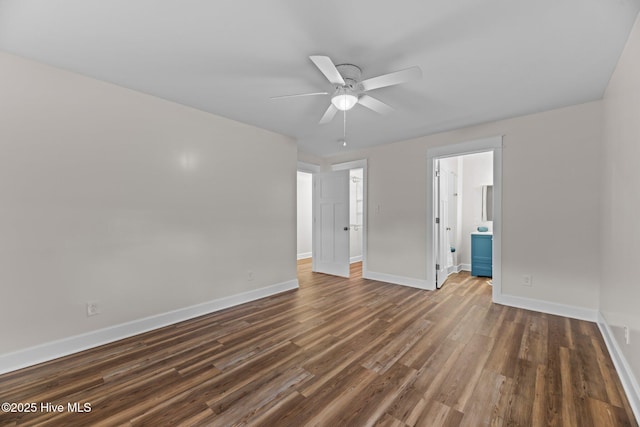 1450 State Camp Rd, Vanceboro, NC 28586 - spare room featuring ceiling fan, baseboards, and dark wood-style flooring