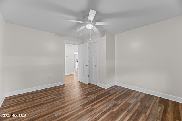 1450 State Camp Rd, Vanceboro, NC 28586 - unfurnished room featuring baseboards, dark wood finished floors, and a ceiling fan
