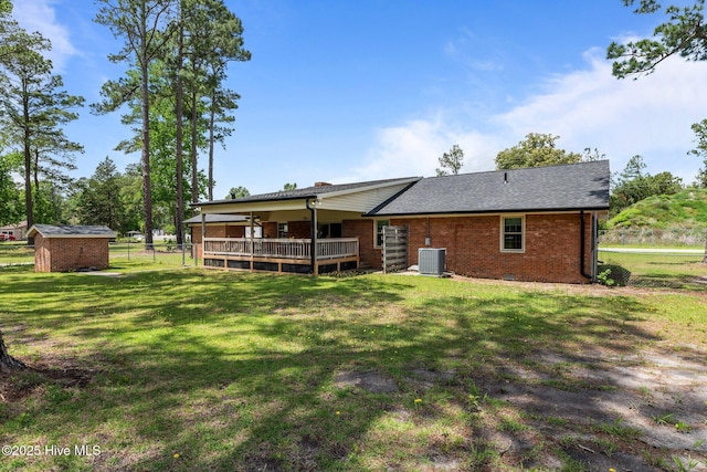 1450 State Camp Rd, Vanceboro, NC 28586 - rear view of property featuring brick siding, a storage unit, central AC, and an outdoor structure