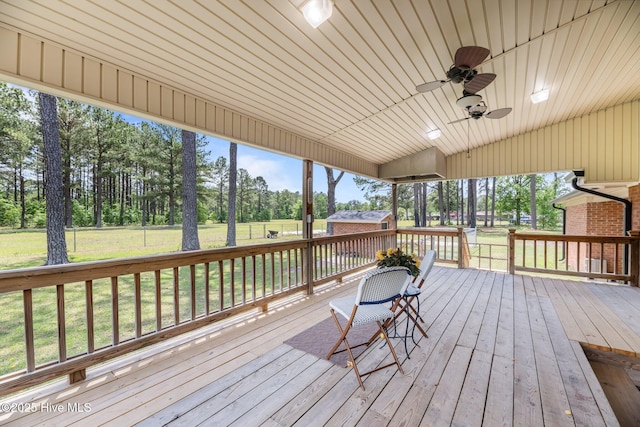 1450 State Camp Rd, Vanceboro, NC 28586 - deck with an outdoor structure, ceiling fan, a lawn, and view of scattered trees