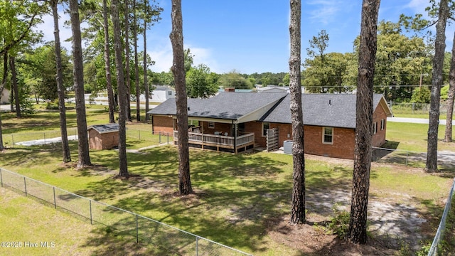 1450 State Camp Rd, Vanceboro, NC 28586 - view of side of home with a deck, brick siding, view of scattered trees, cooling unit, and roof with shingles