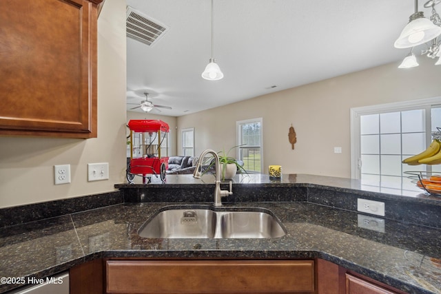 313 March Sea Ln, Jacksonville, NC 28546 - kitchen featuring a sink, pendant lighting, open floor plan, and a ceiling fan