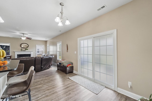 313 March Sea Ln, Jacksonville, NC 28546 - living room with wood finished floors, a chandelier, baseboards, and a fireplace