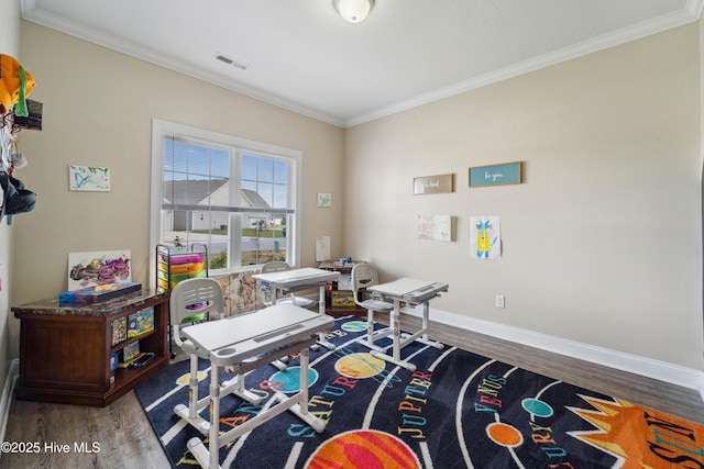313 March Sea Ln, Jacksonville, NC 28546 - recreation room with wood finished floors, crown molding, and baseboards