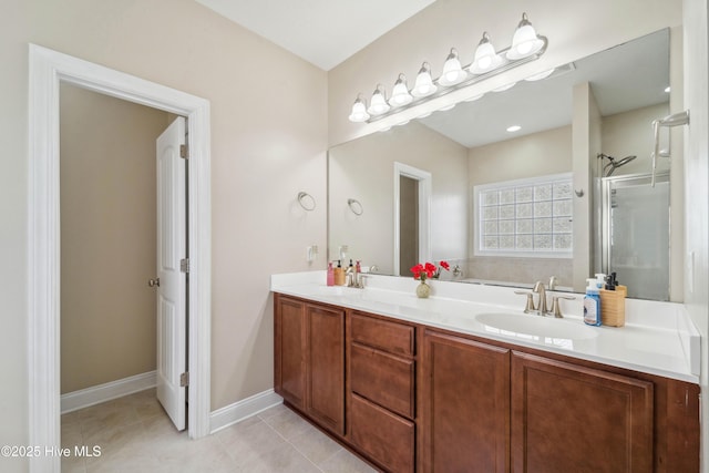 313 March Sea Ln, Jacksonville, NC 28546 - bathroom with double vanity, tile patterned flooring, a shower with door, a garden tub, and baseboards