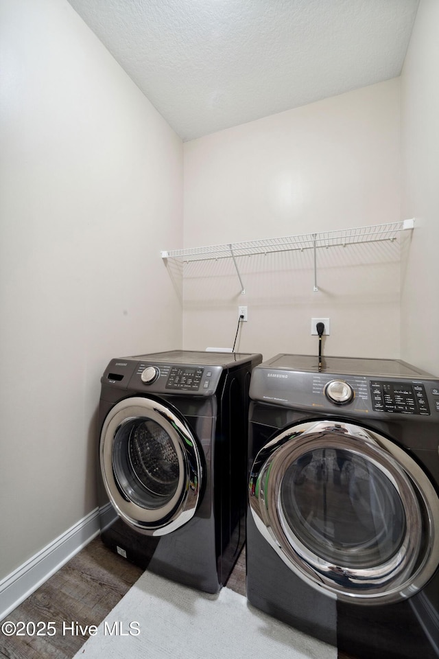 313 March Sea Ln, Jacksonville, NC 28546 - washroom with washing machine and dryer, baseboards, and wood finished floors