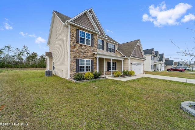 313 March Sea Ln, Jacksonville, NC 28546 - craftsman-style house featuring stone siding, concrete driveway, a front yard, cooling unit, and roof with shingles