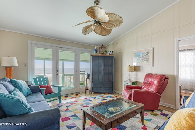 3325 W Beach Dr, Oak Island, NC 28465 - living area featuring french doors, wood finished floors, lofted ceiling, a ceiling fan, and crown molding