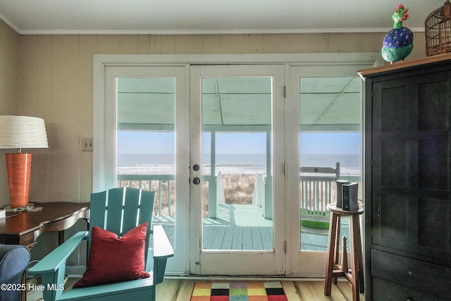 3325 W Beach Dr, Oak Island, NC 28465 - doorway featuring a water view, plenty of natural light, french doors, and wood finished floors