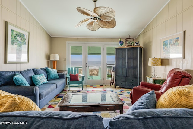 3325 W Beach Dr, Oak Island, NC 28465 - living room with french doors, lofted ceiling, crown molding, a ceiling fan, and wooden walls