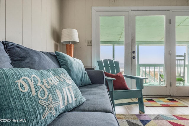 3325 W Beach Dr, Oak Island, NC 28465 - living area featuring french doors, healthy amount of natural light, and wood finished floors